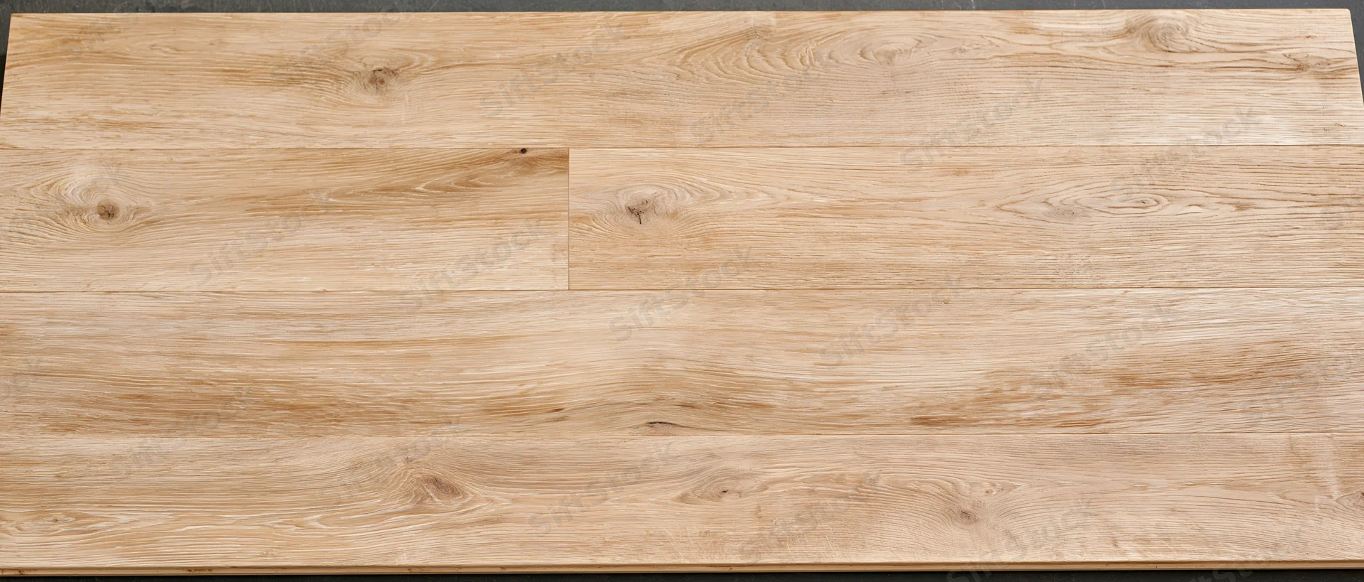 Light oak hardwood floor planks viewed from above showing natural wood grain and texture