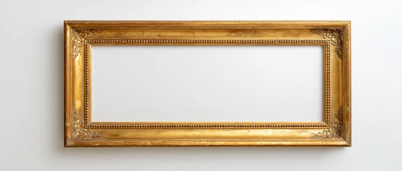Ornate antique gold picture frame hanging on white wall with empty center for display