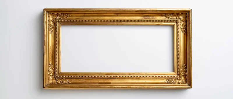Ornate antique gold picture frame hanging on white wall with empty center for display