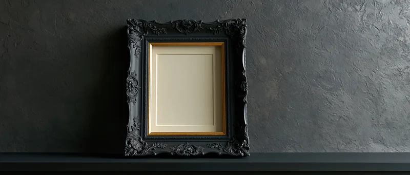 Ornate black baroque frame with gold trim resting on dark shelf against textured gray wall