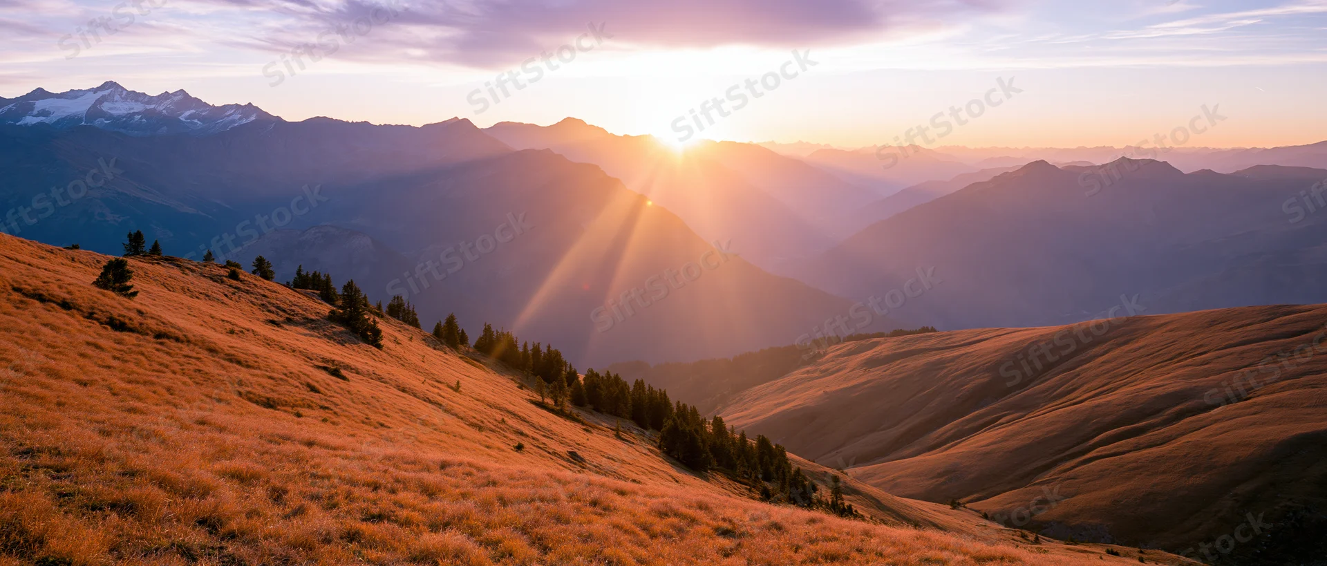 Panoramic alpine landscape at golden sunset with layered mountains and grassy slopes