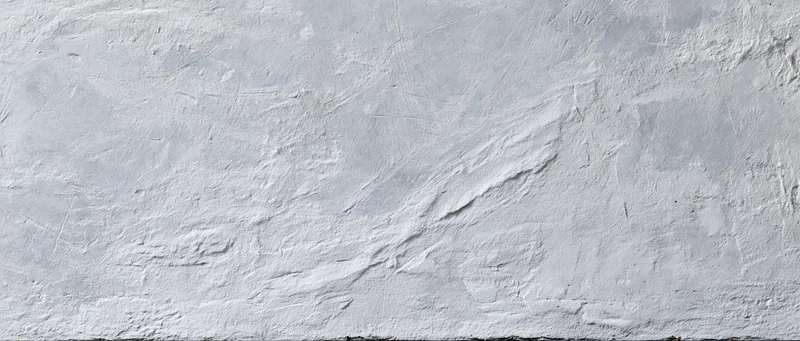 Textured concrete wall surface filling the frame