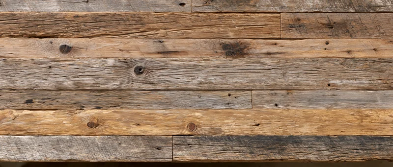 Reclaimed barn wood paneling arranged horizontally as a textured wall surface