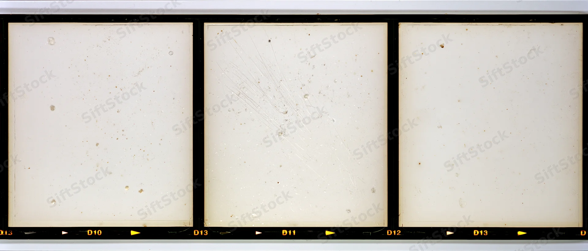 Three blank overexposed medium format film frames arranged horizontally on a contact strip with numbered labels and black borders
