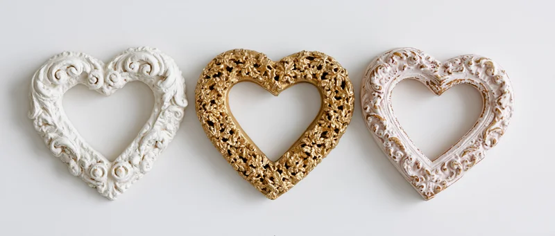 Three ornate baroque heart-shaped frames arranged side by side on white background