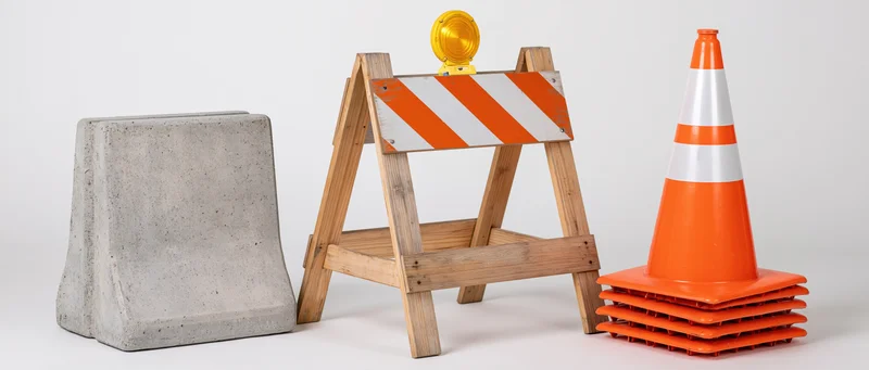 Three road construction safety items arranged side by side on a white surface