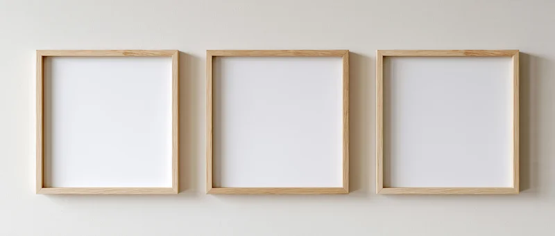Three light oak wooden picture frames arranged horizontally on a white wall