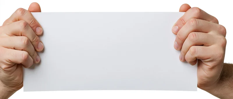 Two adult male hands gripping the edges of a blank white paper sheet against a white background