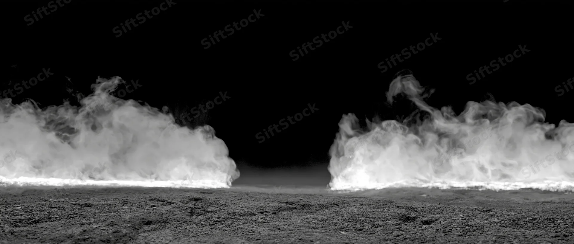 Two columns of white smoke rising and curling from a rough ground surface against a dark background
