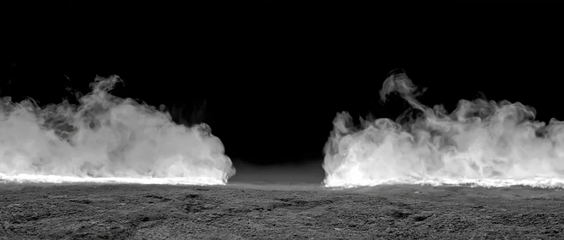 Two columns of white smoke rising and curling from a rough ground surface against a dark background