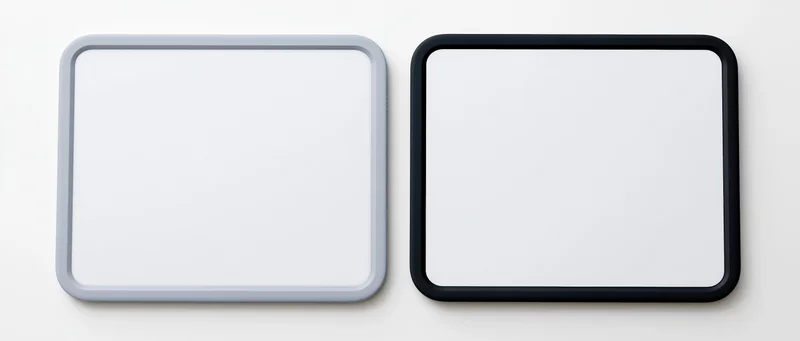 Two tablets with blank white screens side by side on white background