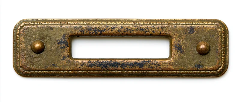 Vintage brass label holder plate with open rectangular window isolated on white