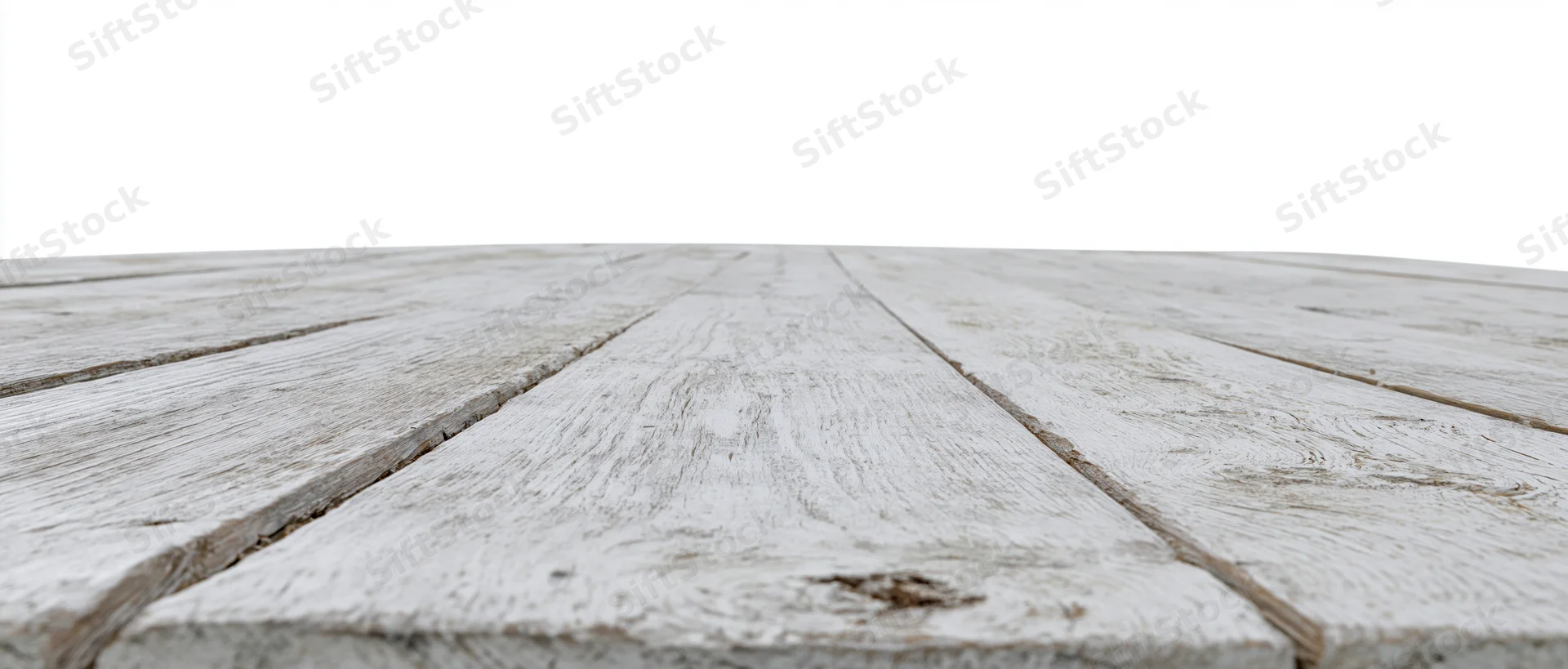 Weathered white-painted wooden floor planks receding into the distance with copyspace above