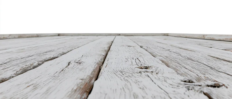 Weathered white-painted wooden floor planks receding into the distance with a clean white background above