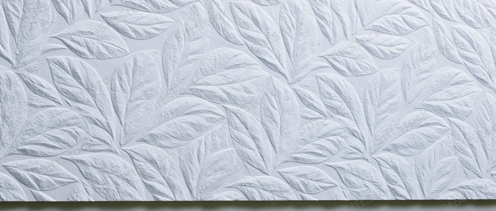 White embossed wall panel with repeating leaf pattern for interior decor