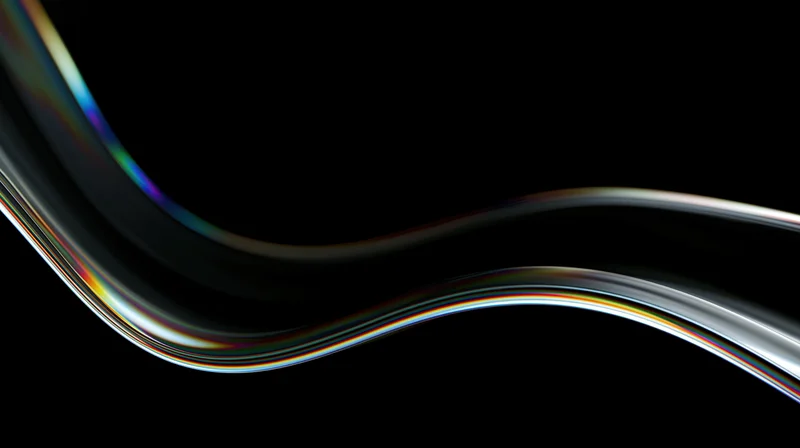 A flowing wave of dark translucent glass with iridescent light reflections on black background