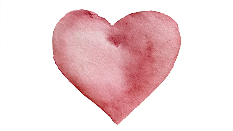 Watercolor heart painted in soft rose pink on white background