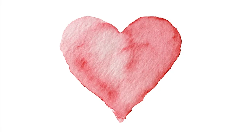Watercolor heart painted in soft rose pink on white background