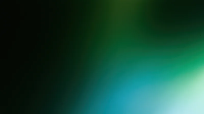 Abstract blurred gradient background transitioning from dark green to light teal
