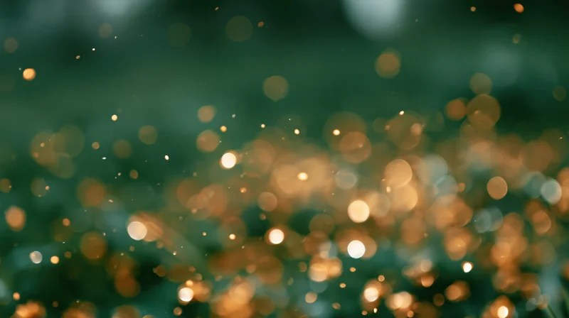 Abstract bokeh background with scattered golden and white lights