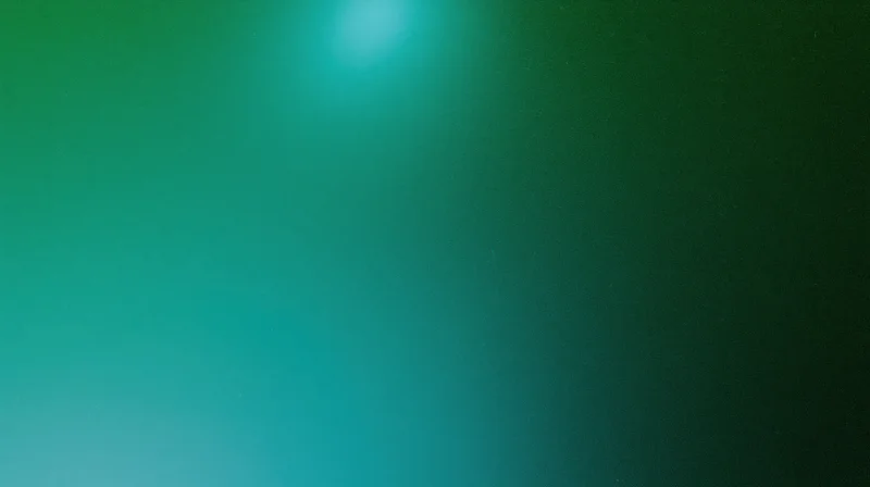 Smooth green to teal color gradient with grainy texture as background