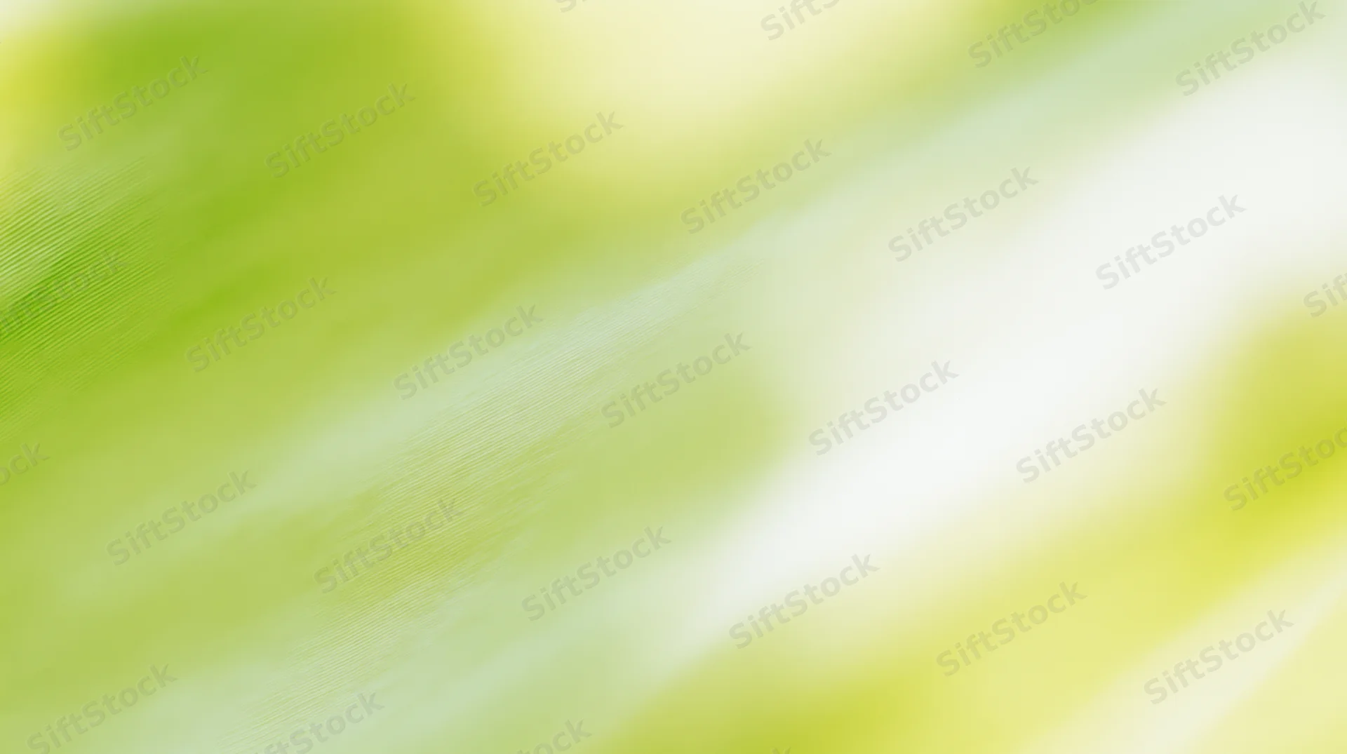Soft green and yellow gradient background with blurred fabric texture