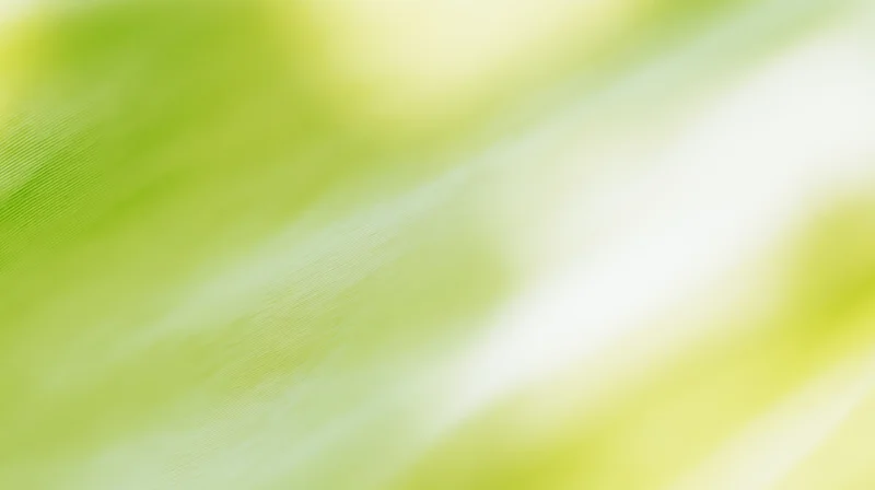 Soft green and yellow gradient background with blurred fabric texture