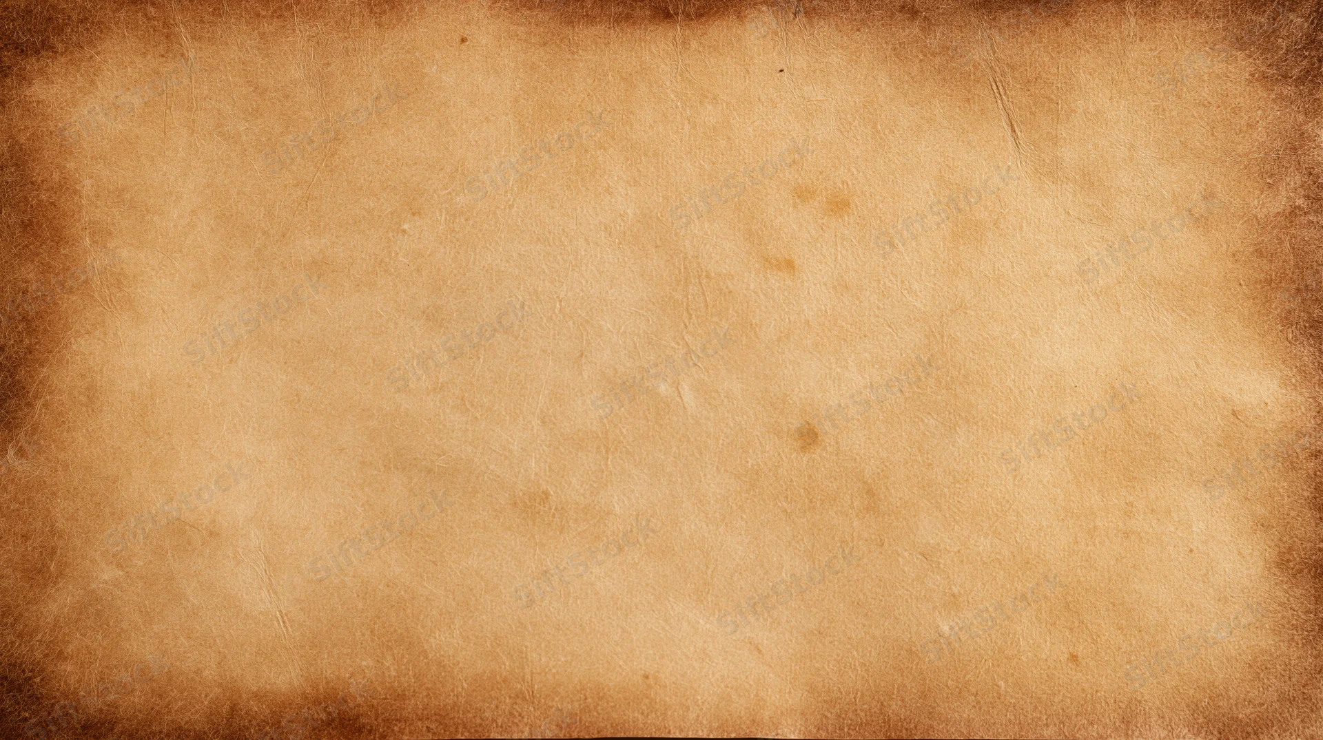 Aged parchment paper sheet filling the frame with textured surface and brown stains
