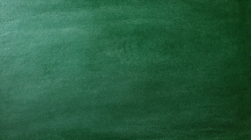 Close-up of a dark green chalkboard surface with textured matte finish