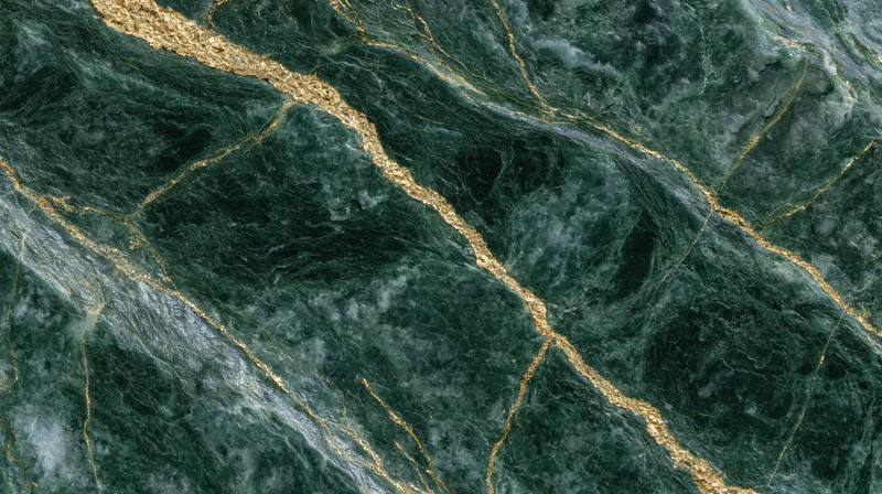 Close-up of polished green marble slab with gold veining for interior design