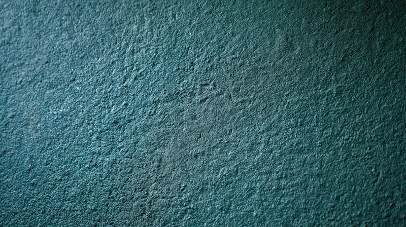 Close-up of rough textured concrete wall surface with blue-gray tone