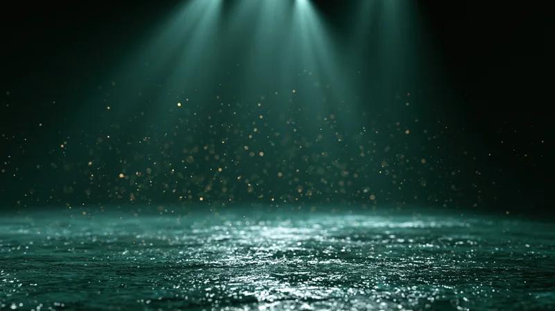 Dark stage floor reflecting teal-green theatrical spotlights with floating particles