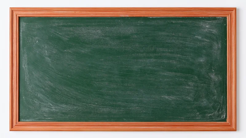 Empty green chalkboard with eraser smear marks in wooden frame on white background