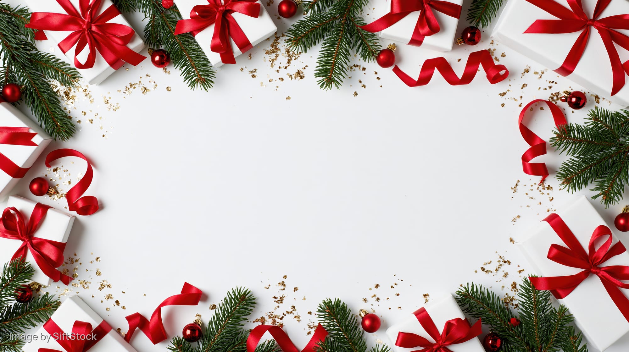 Christmas border frame with gifts, ribbons and pine branches arranged on white surface
