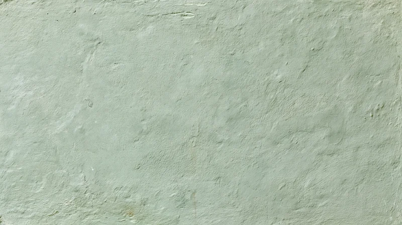 Textured painted concrete wall surface filling the frame