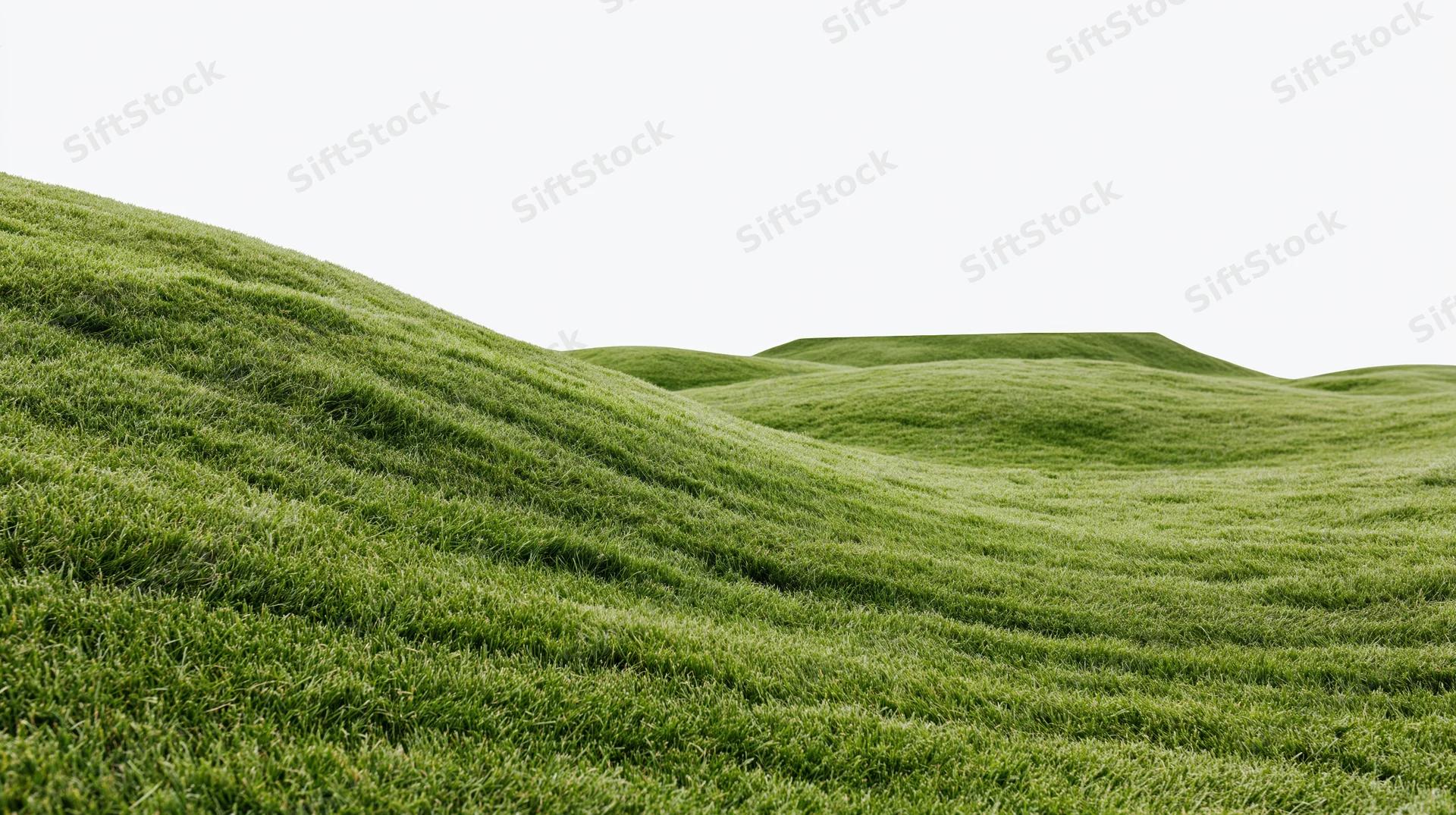 Gently rolling mowed grass hills of a golf course fairway under bright sky