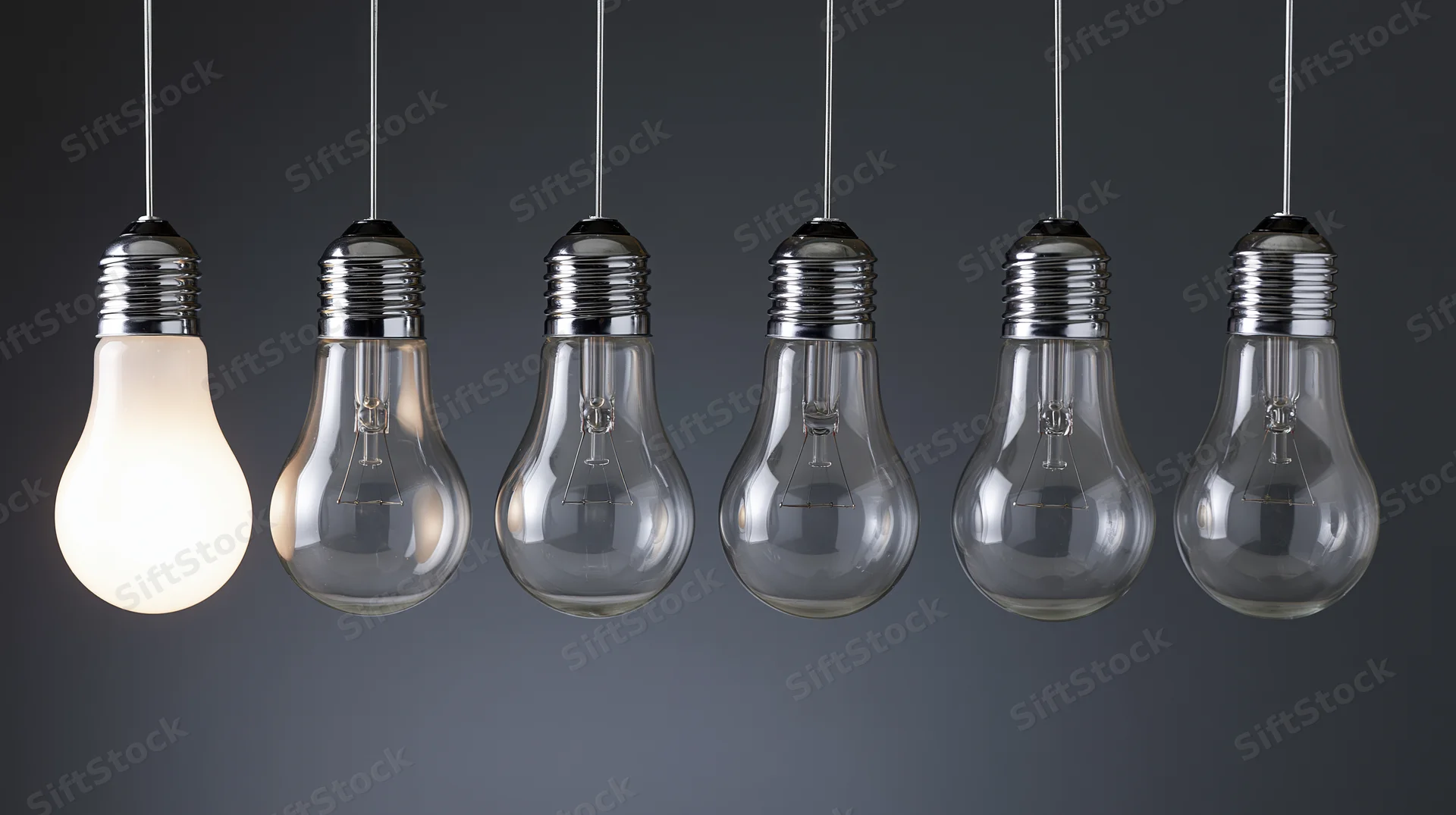 Six incandescent lightbulbs hanging in a row with one illuminated against a dark gradient background
