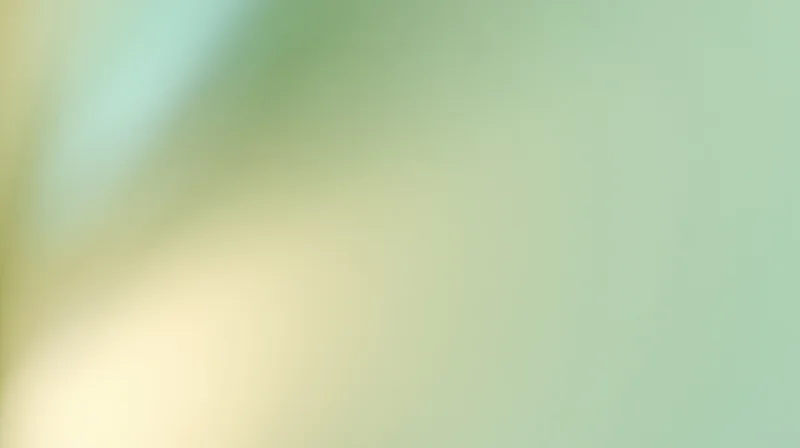 Soft gradient background blending pale green and yellow tones