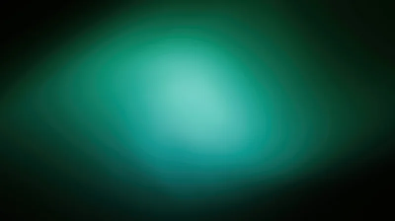 Soft green gradient light bloom with defocused edges on dark background
