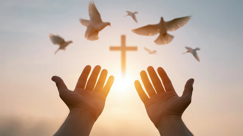 Hands raised palms-up toward a glowing cross and flying doves at sunrise