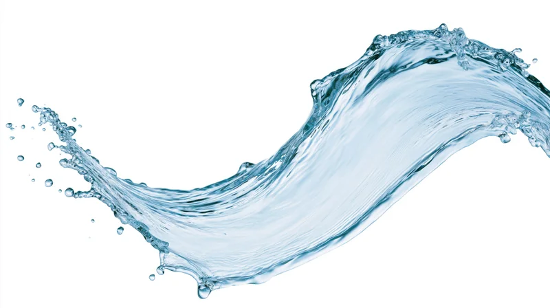 Dynamic water splash curving mid-air against white background