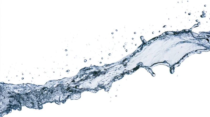 Dynamic water splash frozen mid-motion elongated wave form on white background