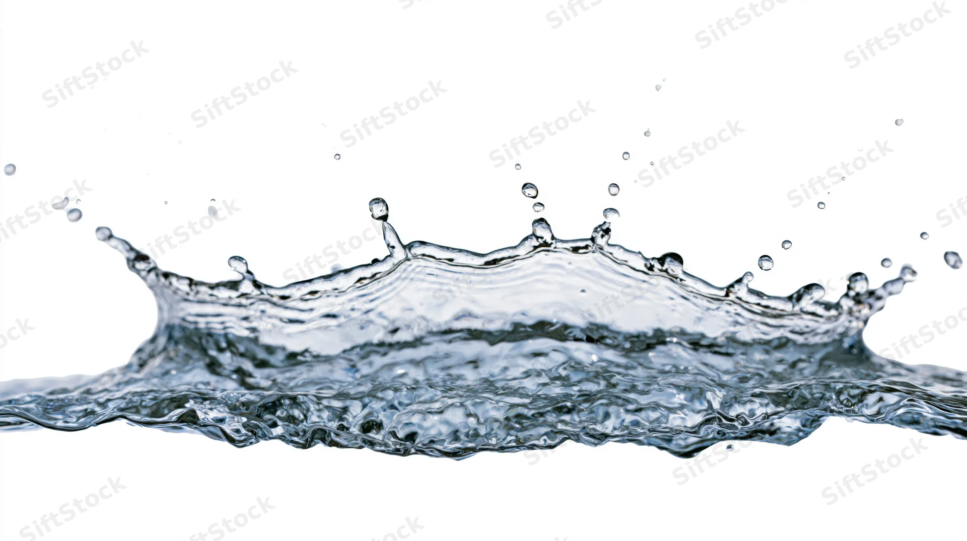 Water splash frozen mid-motion forming a crown shape against white background