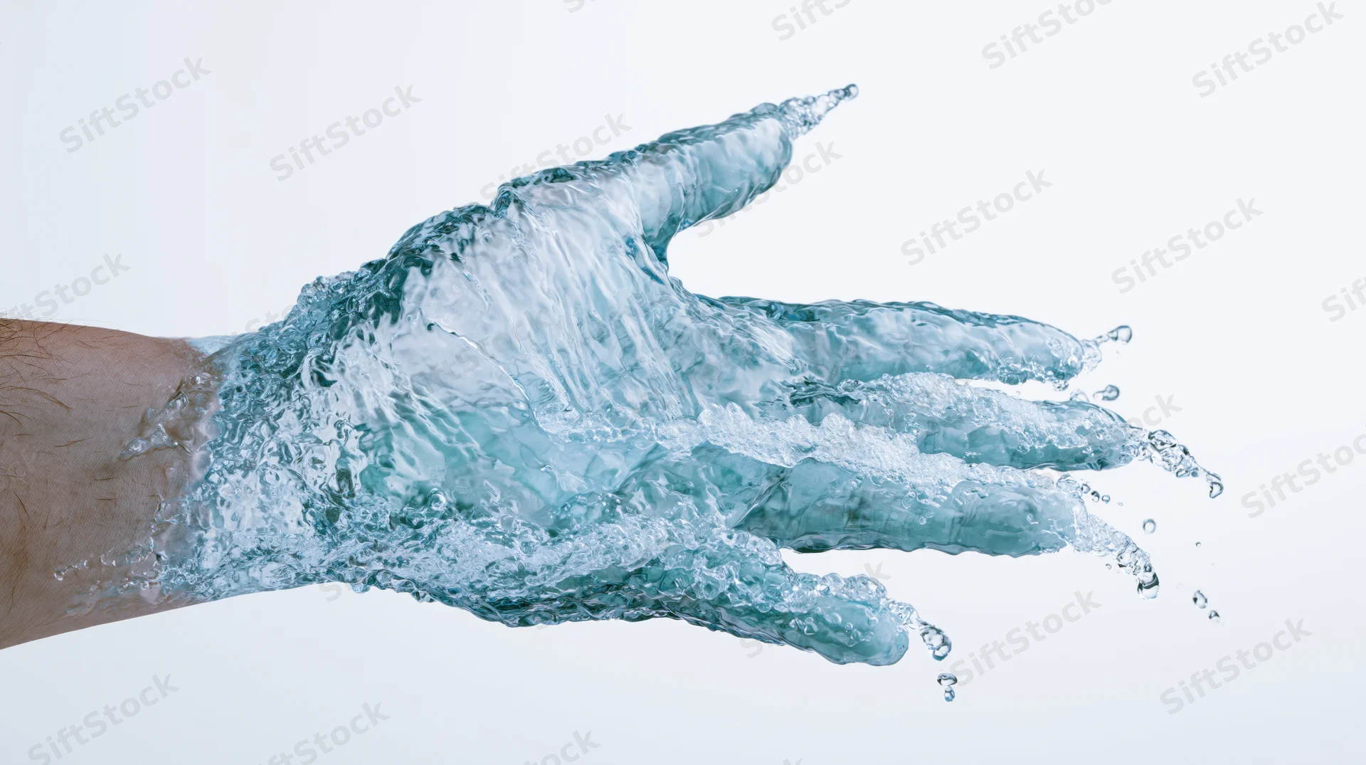 Water forming a human hand shape in motion against a white background