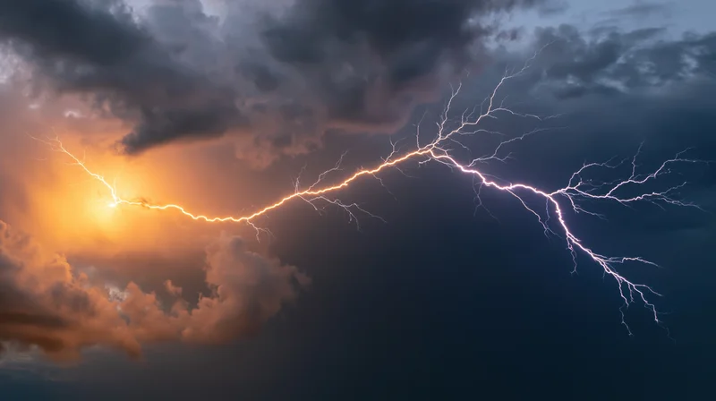 Jagged lightning bolt branching across stormy night sky