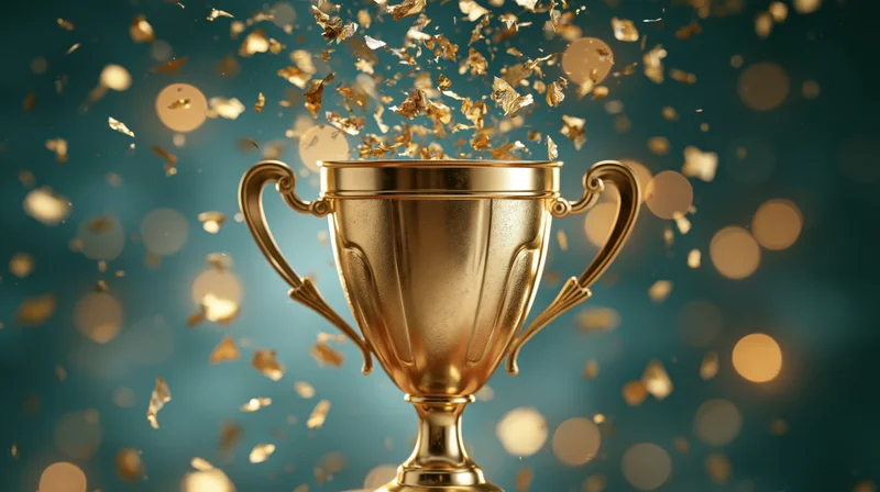 Golden trophy cup with confetti bursting from top against teal bokeh background
