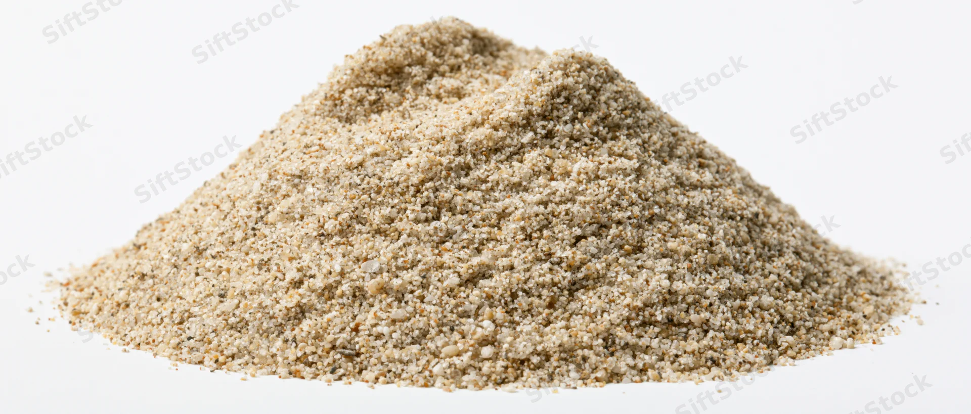 A heap of dry fine-grained beach sand on a white background