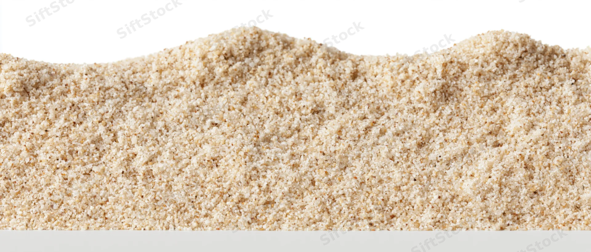 A heap of fine-grained beach sand isolated on white