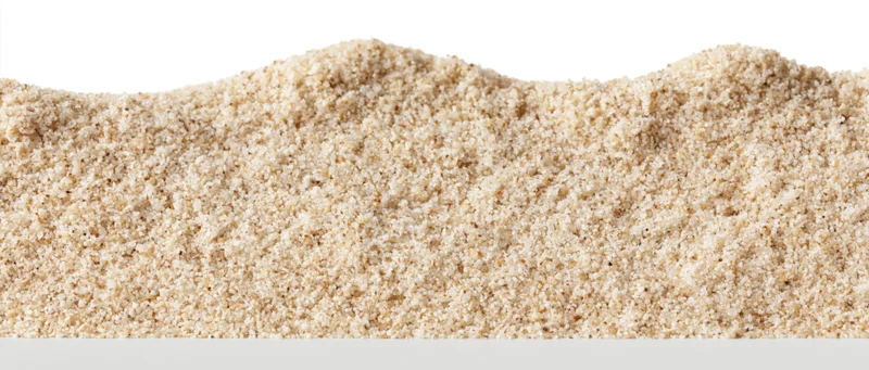A heap of fine-grained beach sand isolated on white