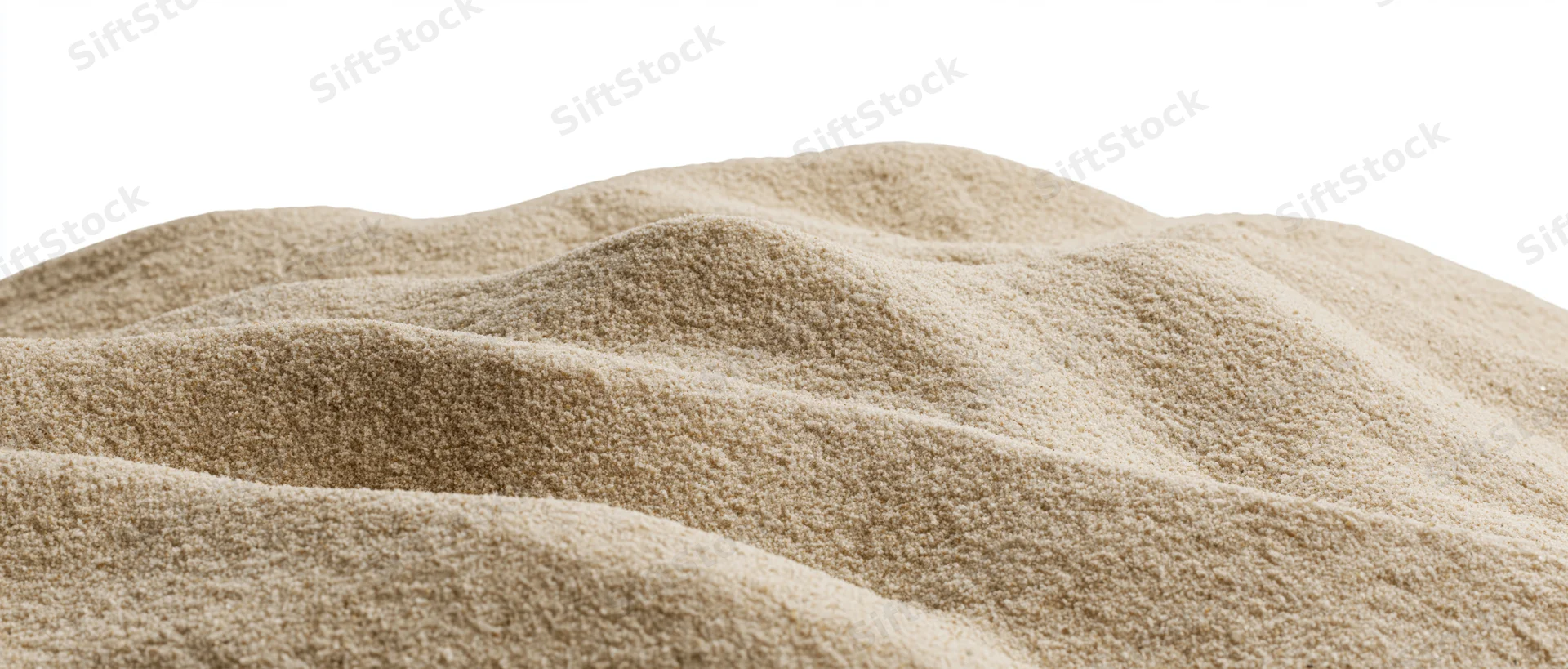 Mound of dry beach sand with undulating surface isolated on white
